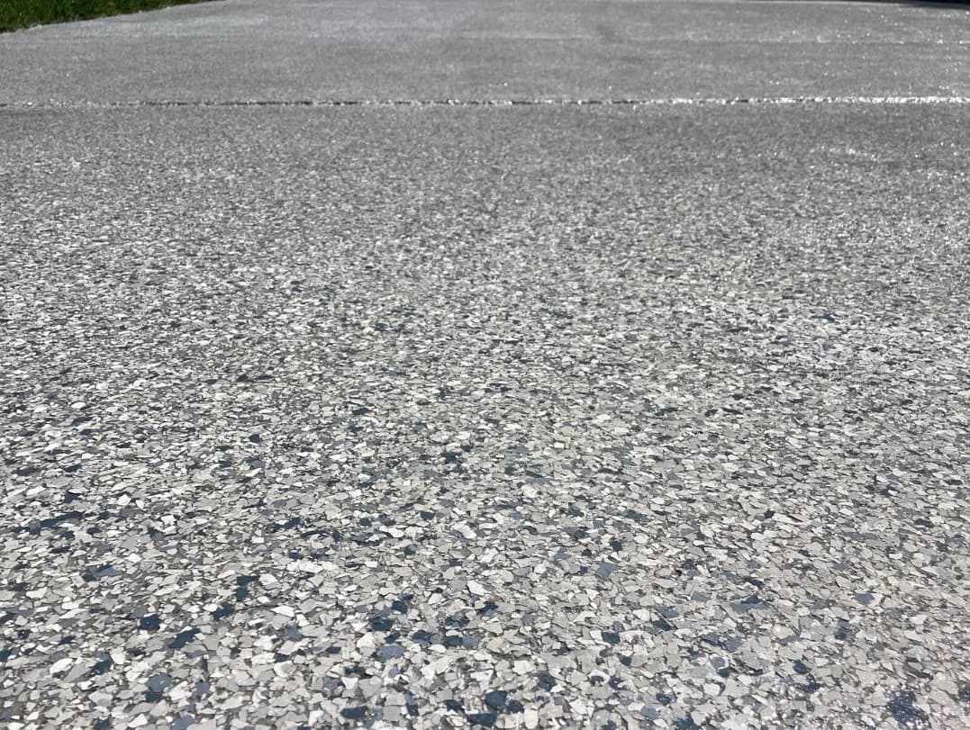A finished flake floor across a full garage bay