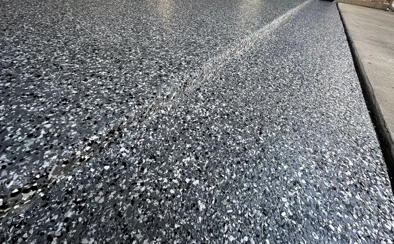 Finished flake floor running out onto the driveway apron
