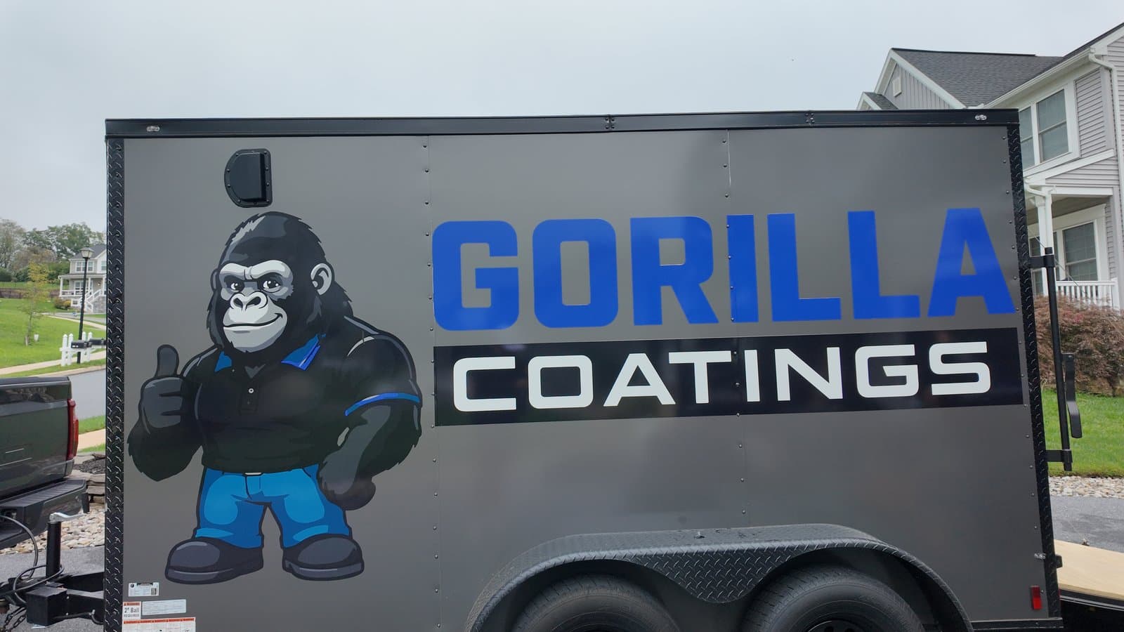 The Gorilla Coatings trailer parked outside a job